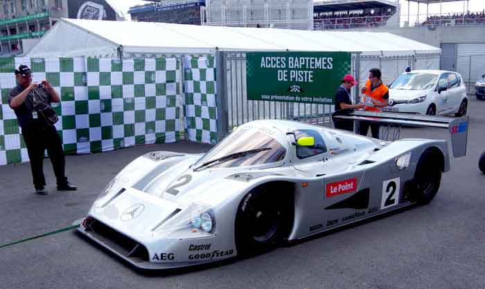 "White diesel-powered race car on a track, illustrating efficiency and performance, on digipdemo.com article about diesel benefits."